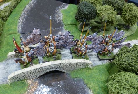 Winged lancers crossing a bridge