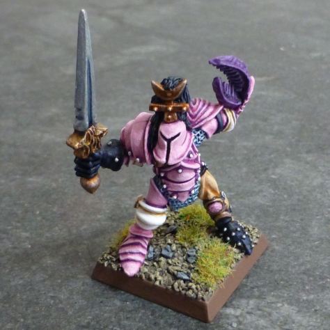 Front of Chaos Warrior of Slaanesh in pink armour with sword