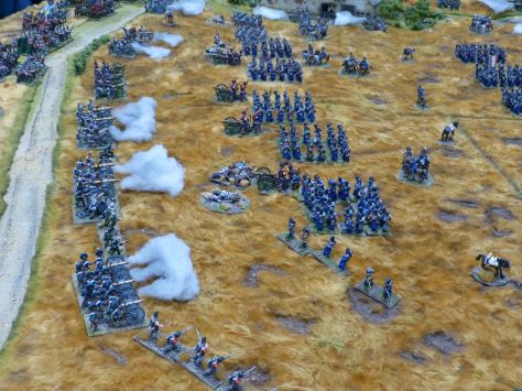 Cannons firing at advancing infantry