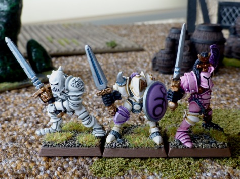 Front view of three Slaaneshi Warriors of Chaos with various armaments