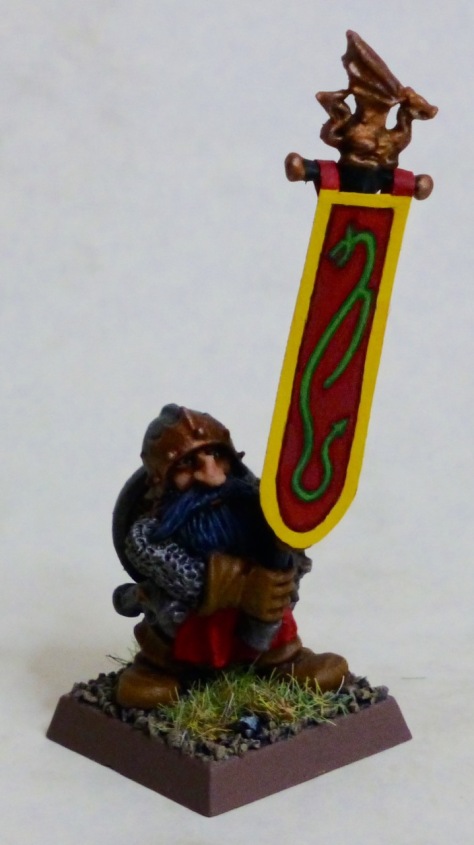 Dwarf standard bearer carrying the banner with a green dragon on red field