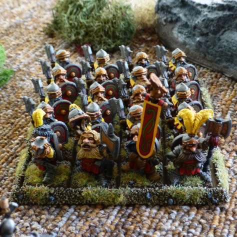 A twenty strong regiment of Dwarfs from Prince Ulther's Dragon Company in red and yellow livery