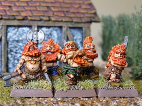 Unit of five orange haired, bare chested Dwarfs