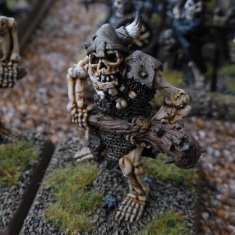 Skeleton ogre with horned helmet and large club