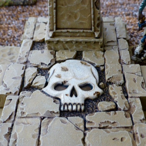 Sandstone floor of a small temple inlaid with a skull design