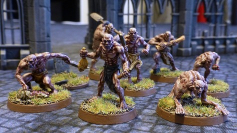 A pack of seven ghouls in a ruined city scape