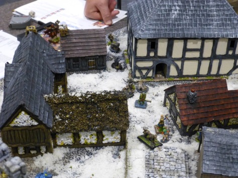 Medieval city streets under snow with adventurers and undead