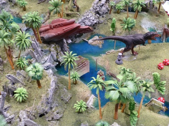 Jungle terrain with a crashed space craft and large dinosaur