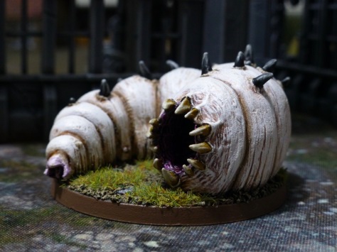 A giant white maggot with a fanged maw