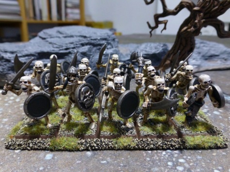 Fifteen skeletons in three ranks with shields and handweapons