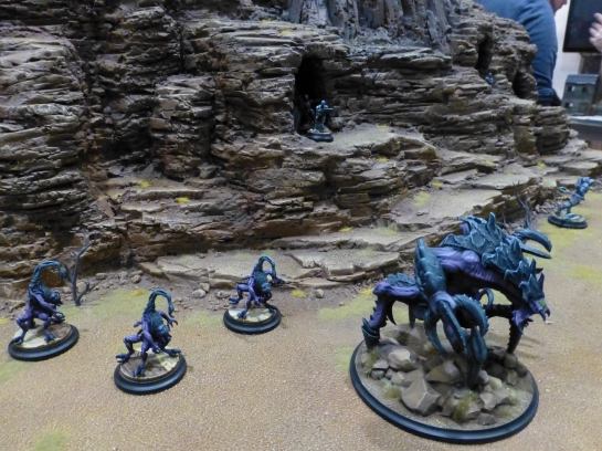 Rugged mountainside with arachnid blue monsters
