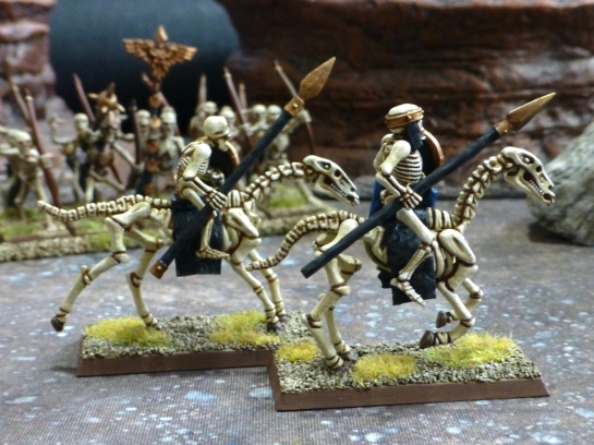 Two skeletal riders carrying bronze tipped spears